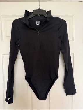 Woman’s OQQ Black Ribbed Long-Sleeve One-Piece Bodysuit - Zip Neck
